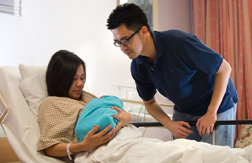 new parents in hospital with their baby