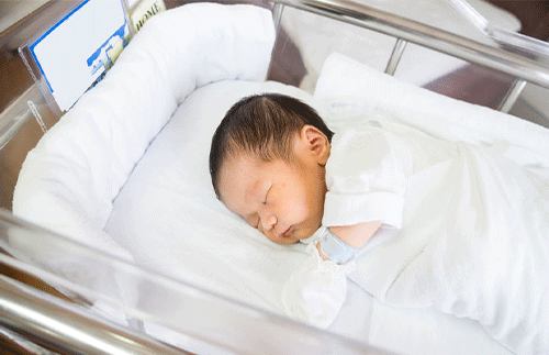 newborn sleeping in hospital