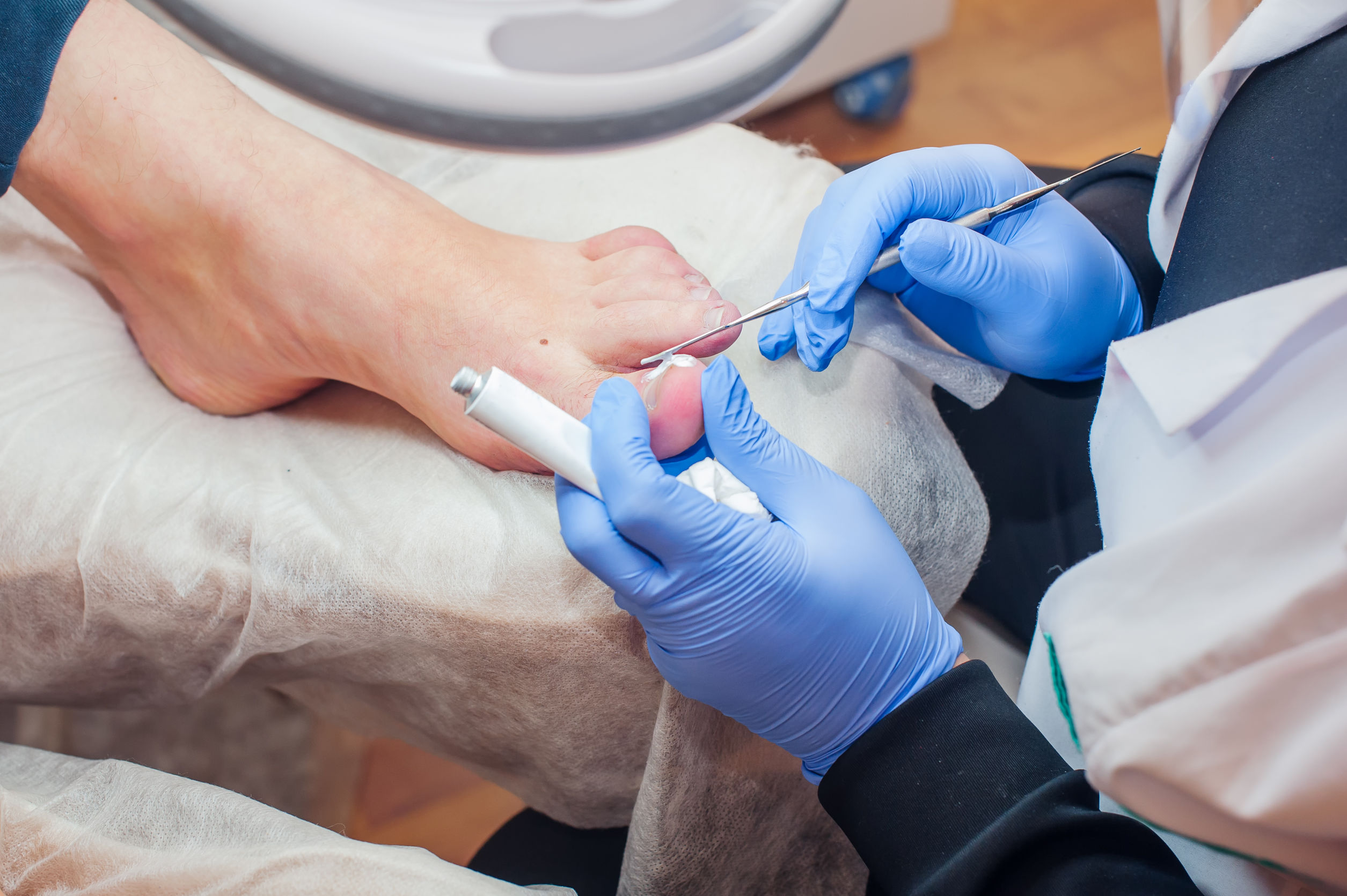 doctor performing a foot procedure