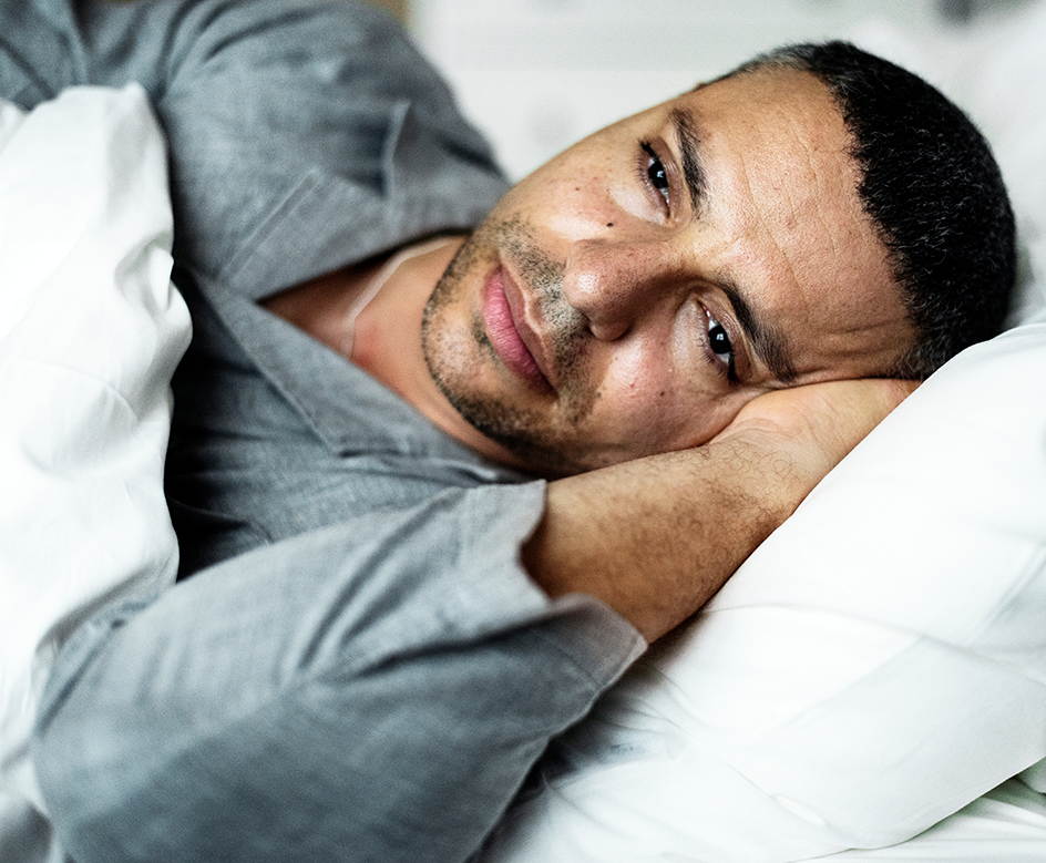 Man lying in bed