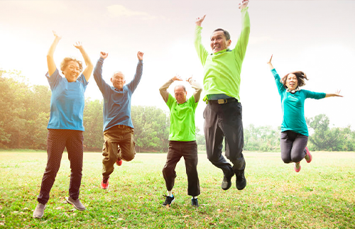 happy people jumping outside