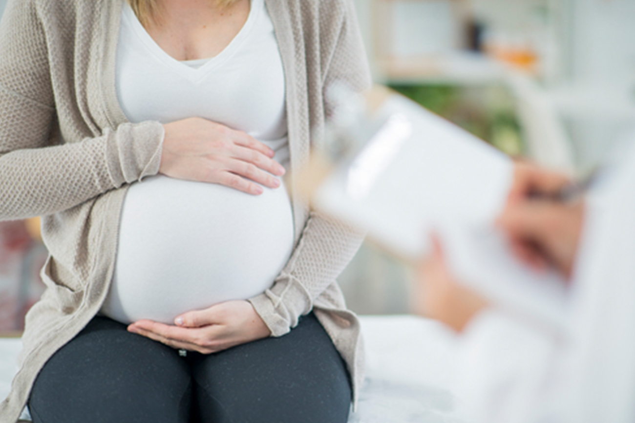 pregnant women in doctors office