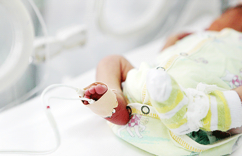 Close up of vitals monitor on premature baby foot