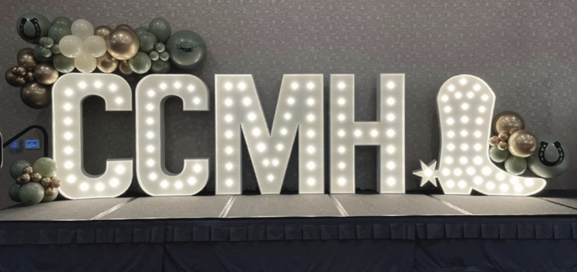 Decorated table with CCMH light letters