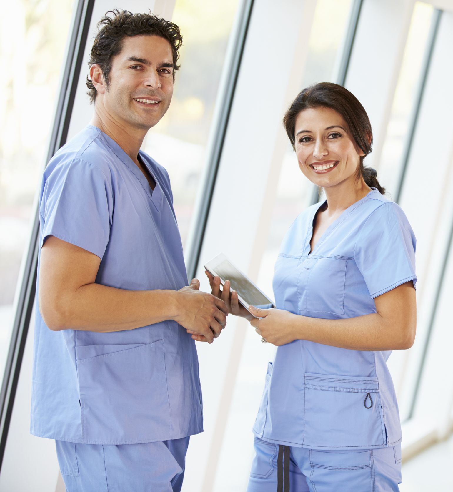 smiling doctors in scrubs