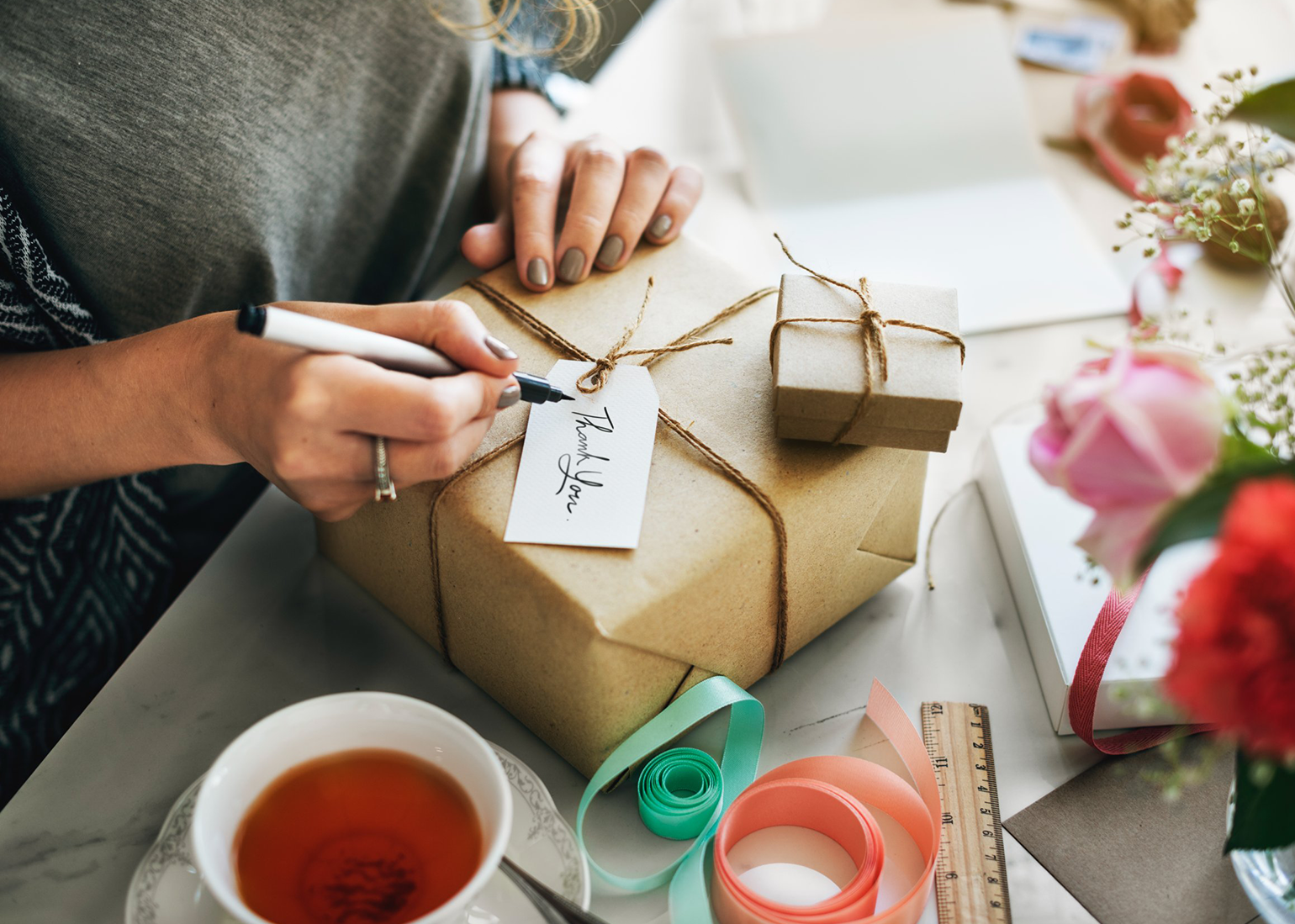 A woman wrapping a gift