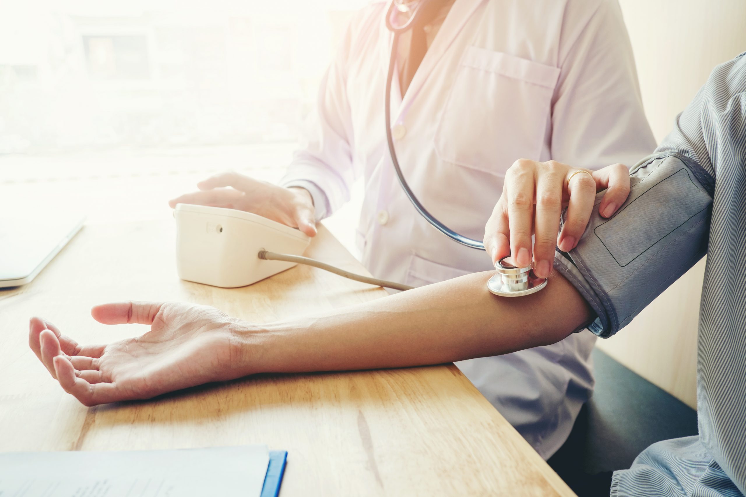 nurse taking a patient's blood pressure